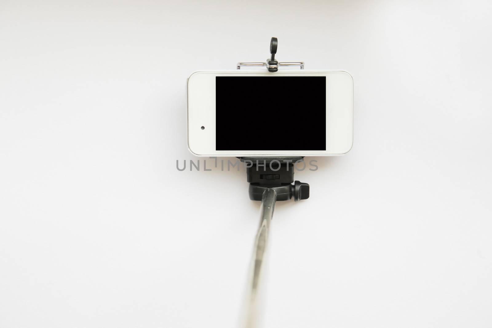 Selfie stick for smartphone isolated on white