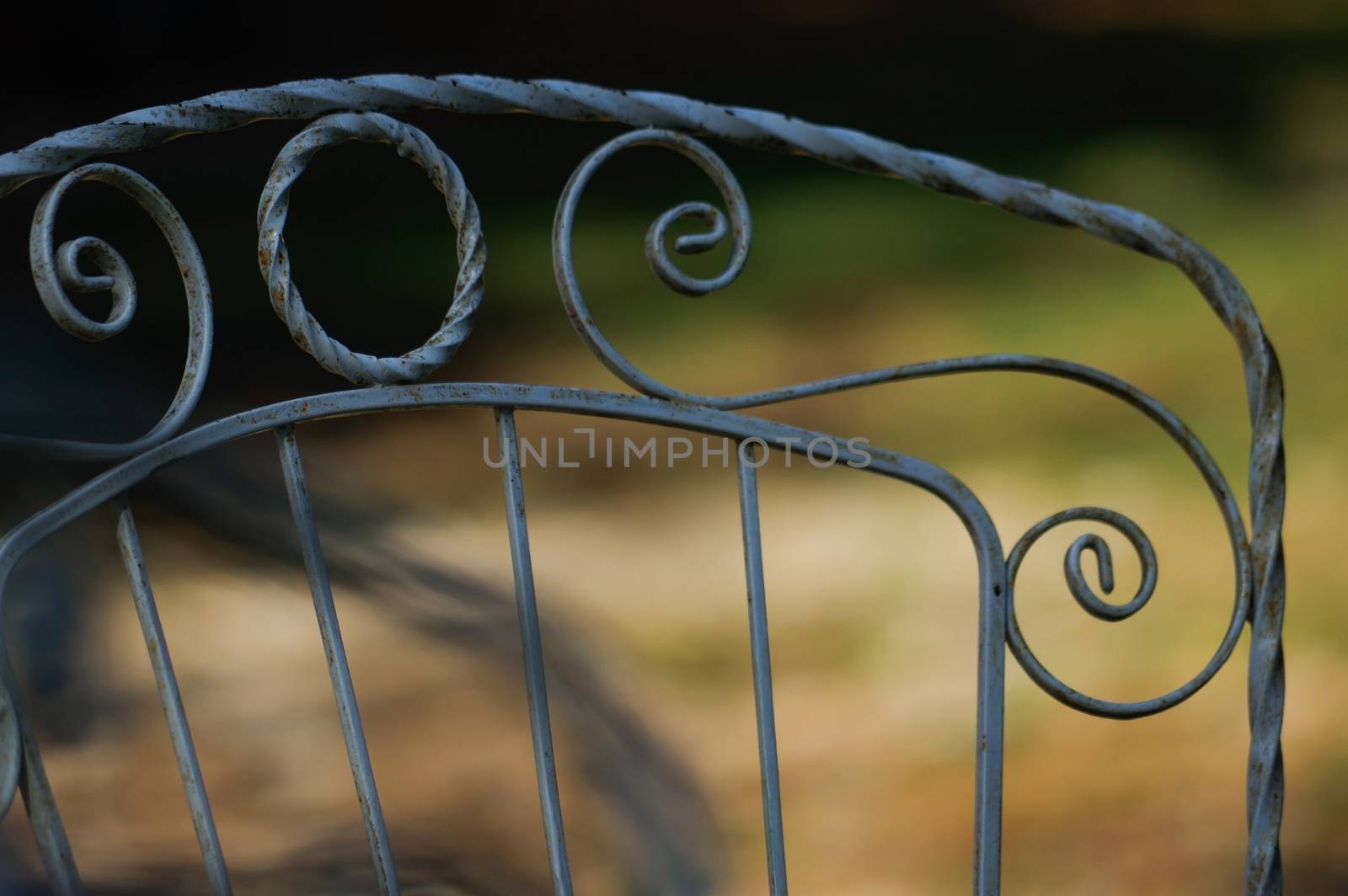 a close-up view of a part of iron old park bench