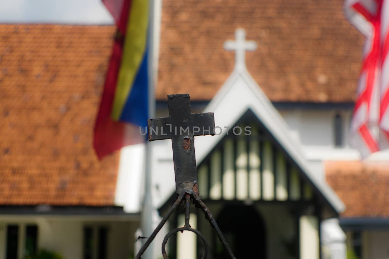 Close up of a iron cross on  church in Kuala Lumpur, Malaysia wi by evolutionnow