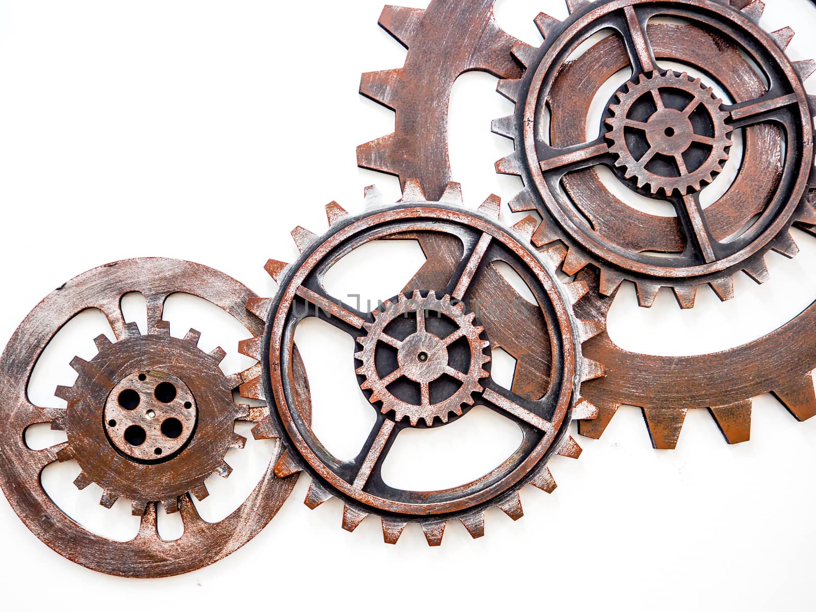 Gear wheels with rusty metal isolated on white background by worrayuth