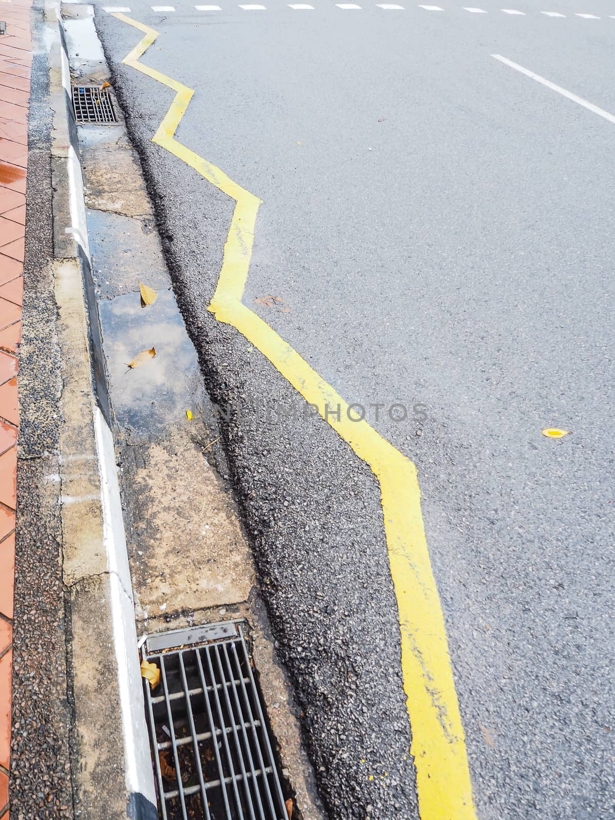 Sign on surface of street, yellow  zigzag line by worrayuth