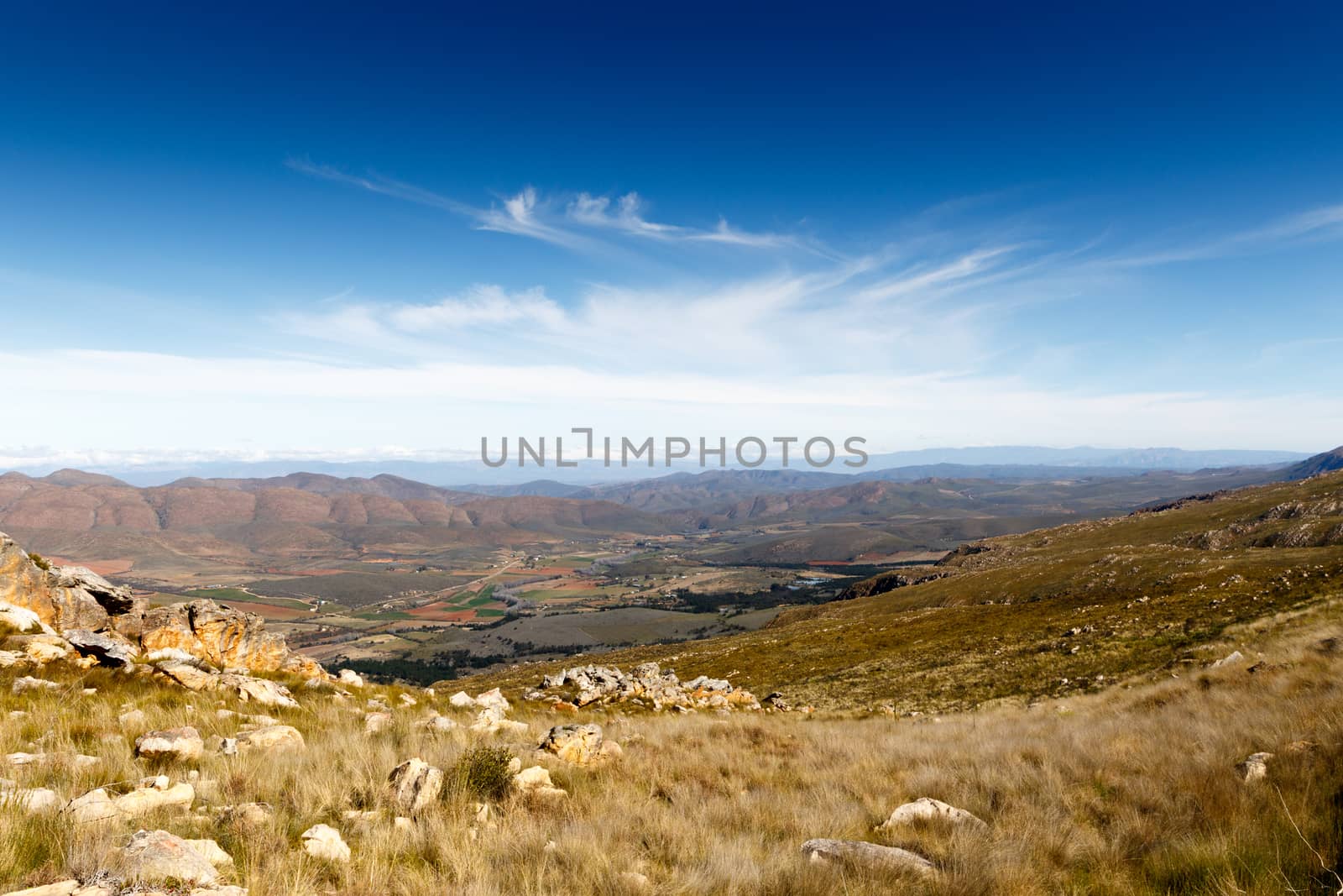 Landscape view - Farmland on a plato with mountains in the background looking over the beautiful Swartberg.