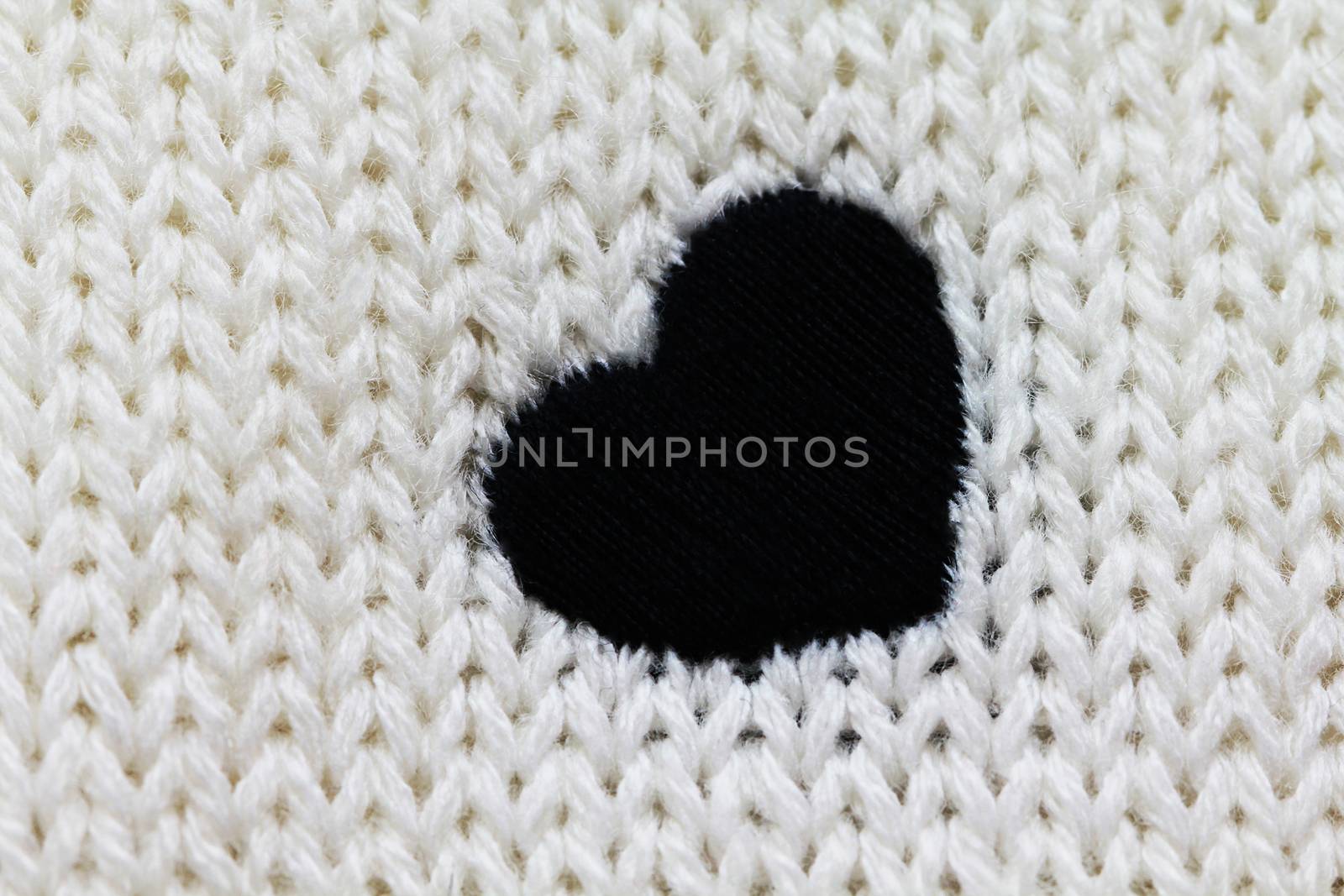 Knitted background with heart by Voinakh