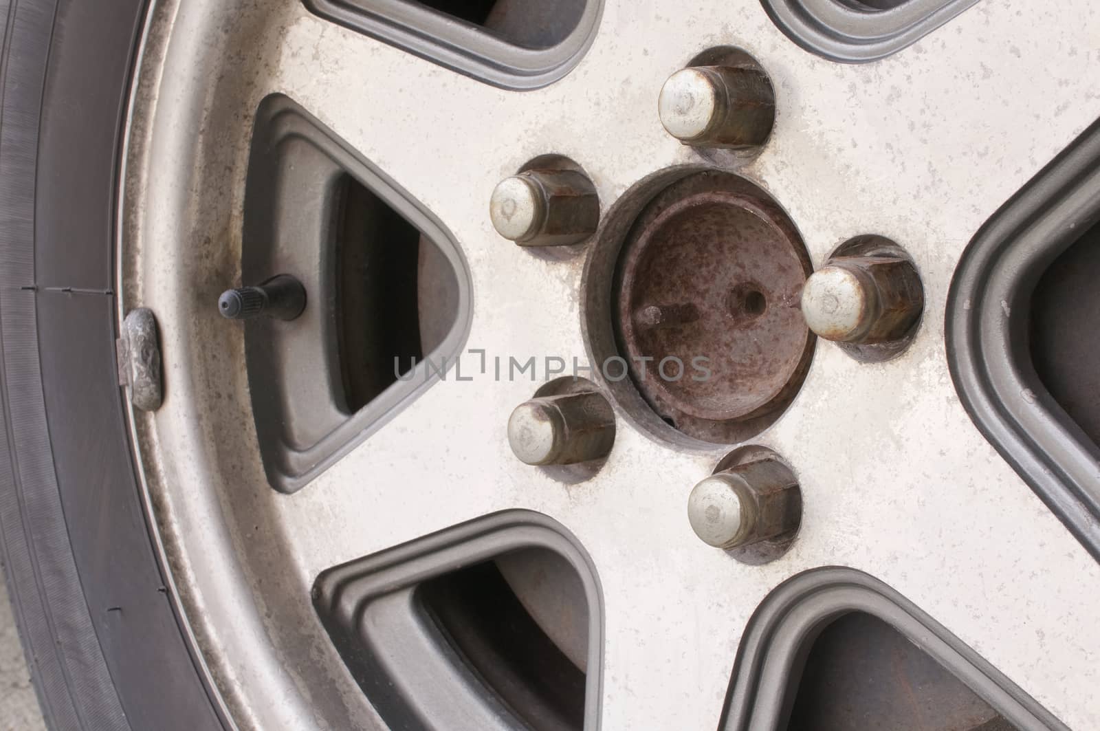 Close up old and rust car wheel with disc brake.