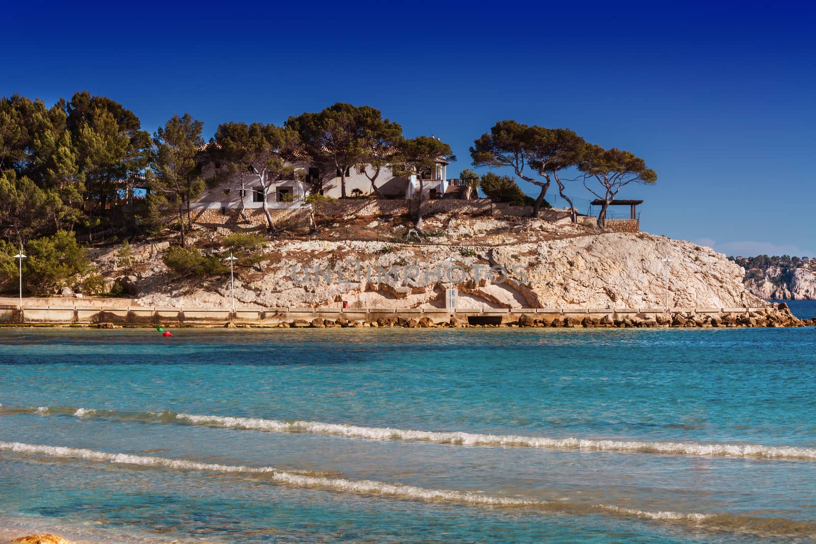 Views of the Bay of Paguera with a sandy beach and azure waters, Mallorca, Spain.