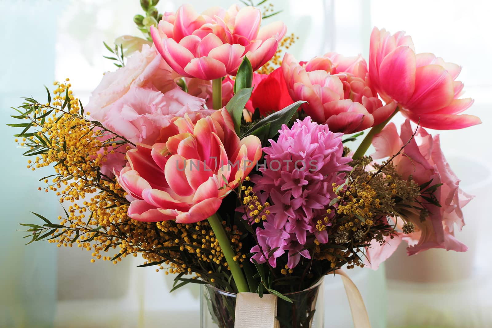 Bouquet of different flowers including tulips and mimosa