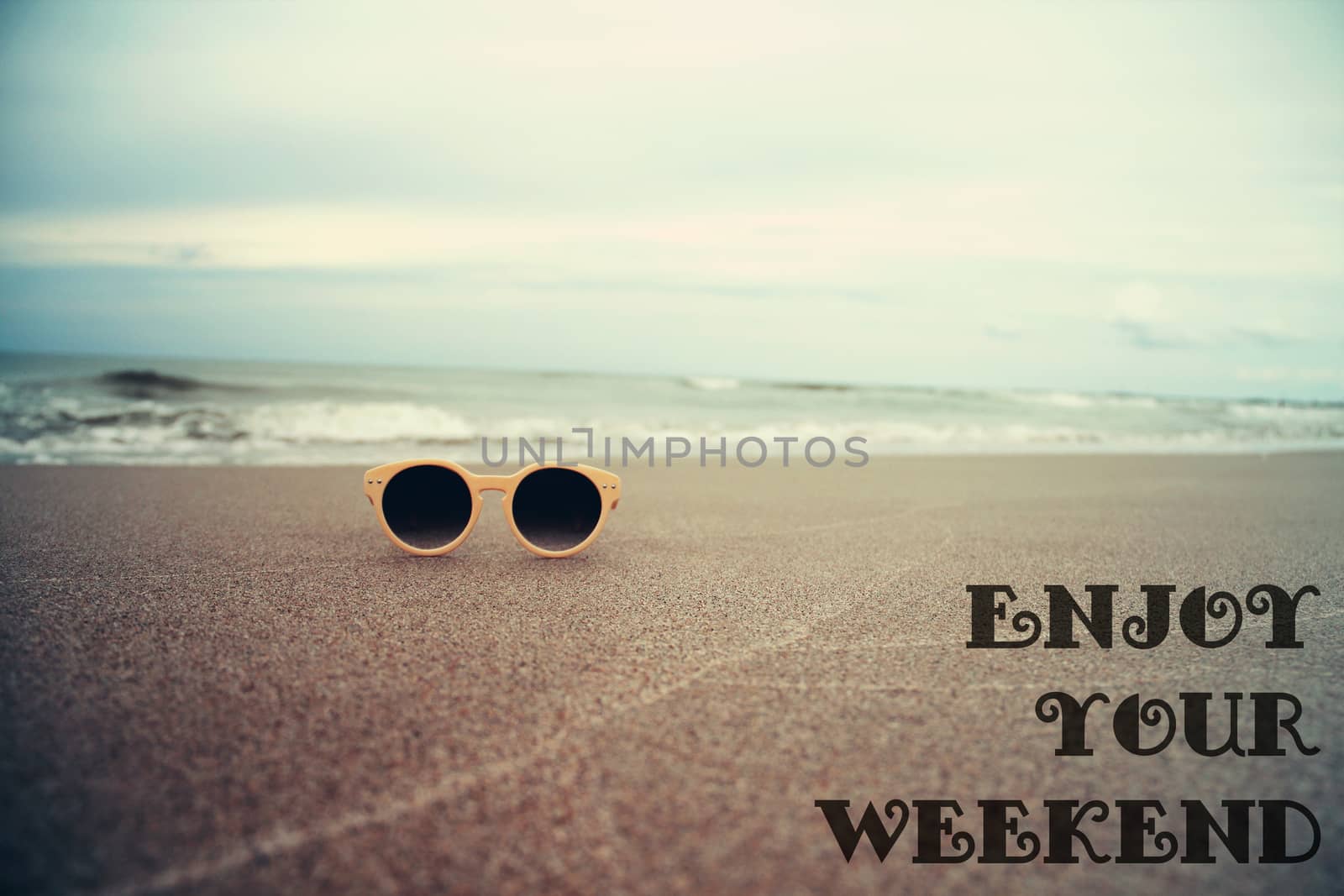 Sunglasses on the sand on beach beautiful summer photo in vintage style