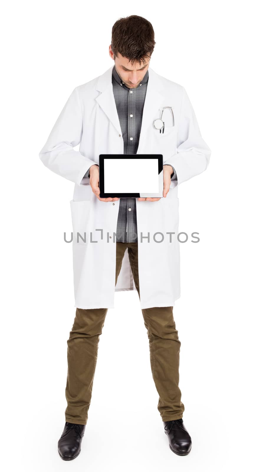 Doctor holding tablet with copy space and clipping path for the  by michaklootwijk