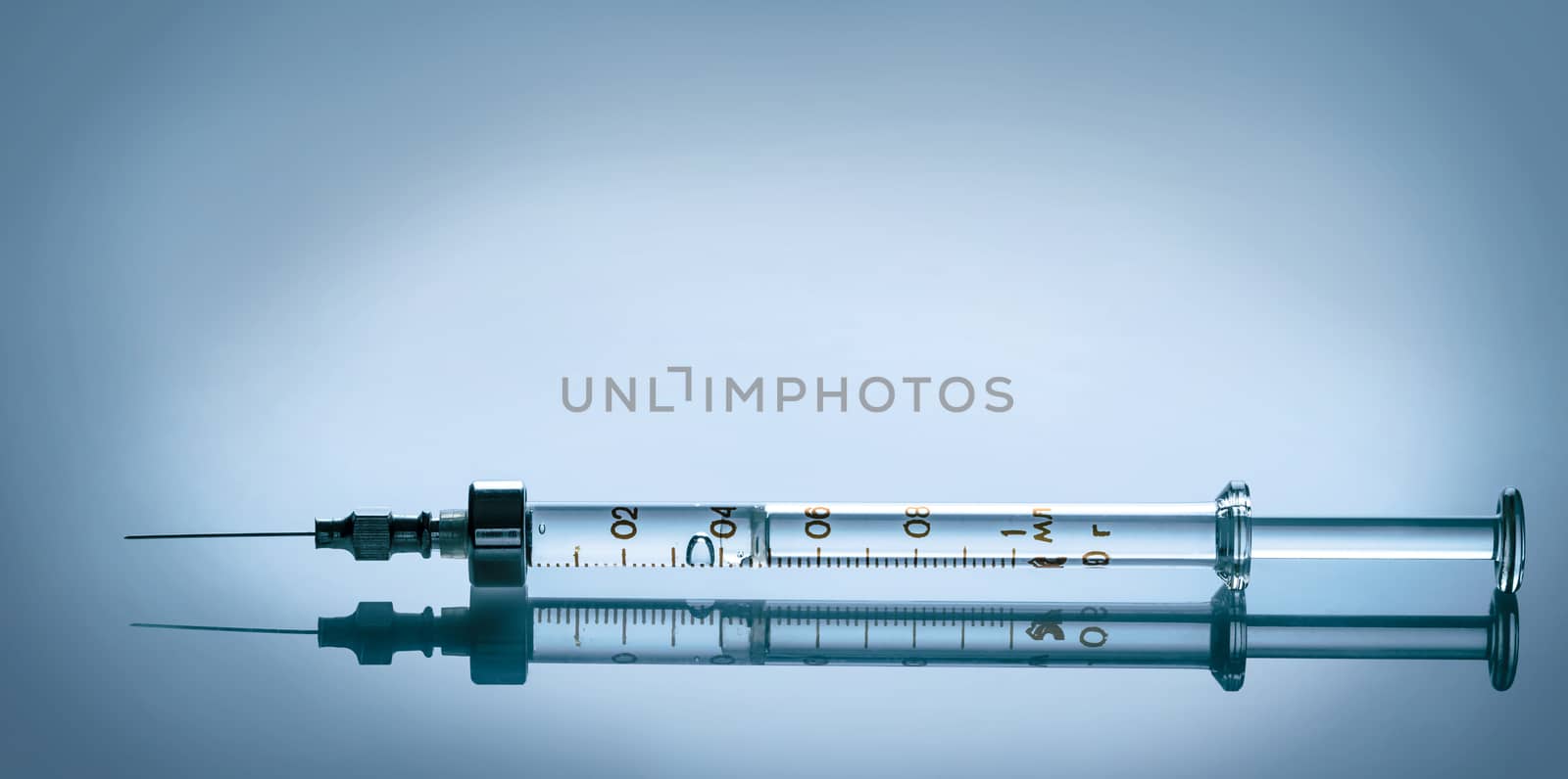 with the reflection of closeup a medical syringe