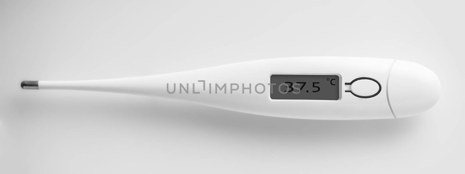 the electronic thermometer closeup on a white background