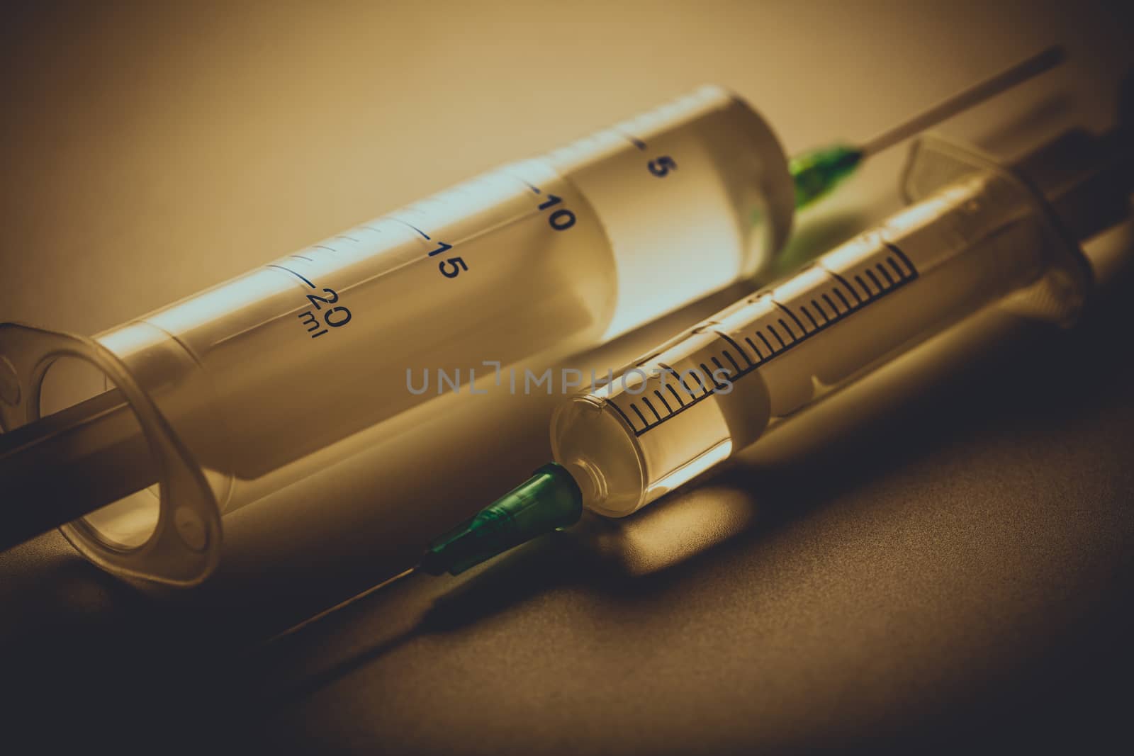Two medical syringe close-up with a narcotic substance