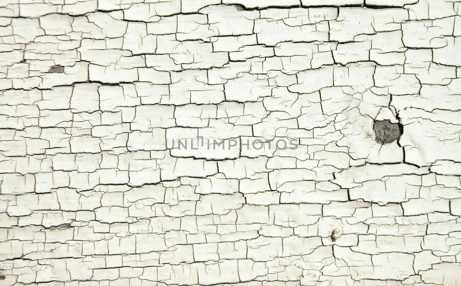 Cracked white paint texture on old wood by mowgli