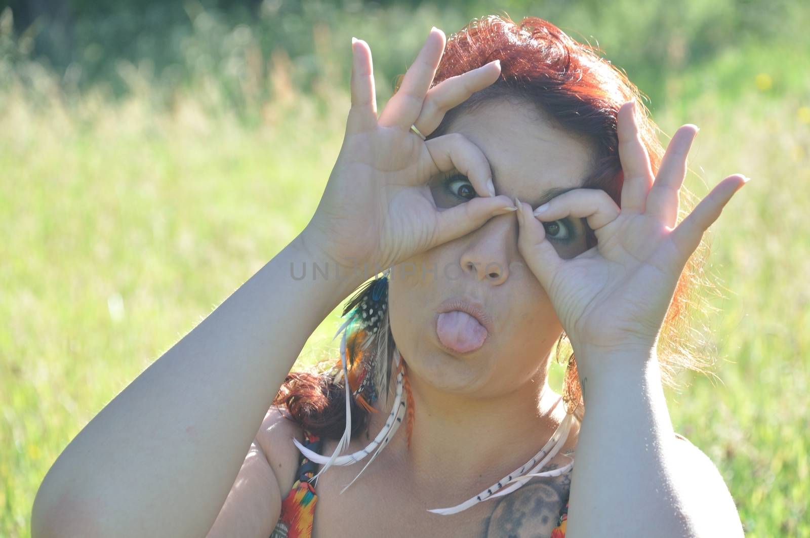 portrait of red  hair woman in a park