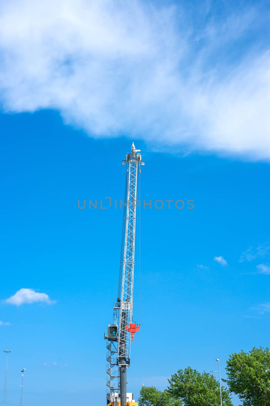 Large crane machinery in daylight and blue sky