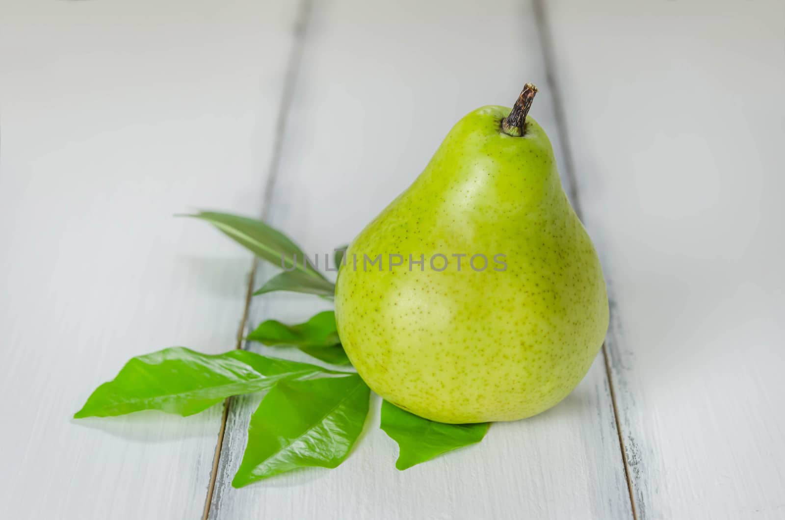 Fresh pears on the wooden background. Still life