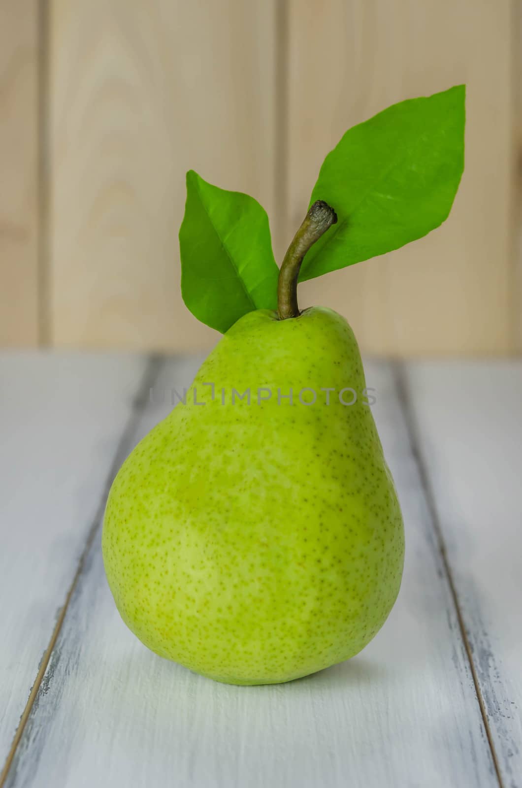 Fresh pears on the wooden background. Still life