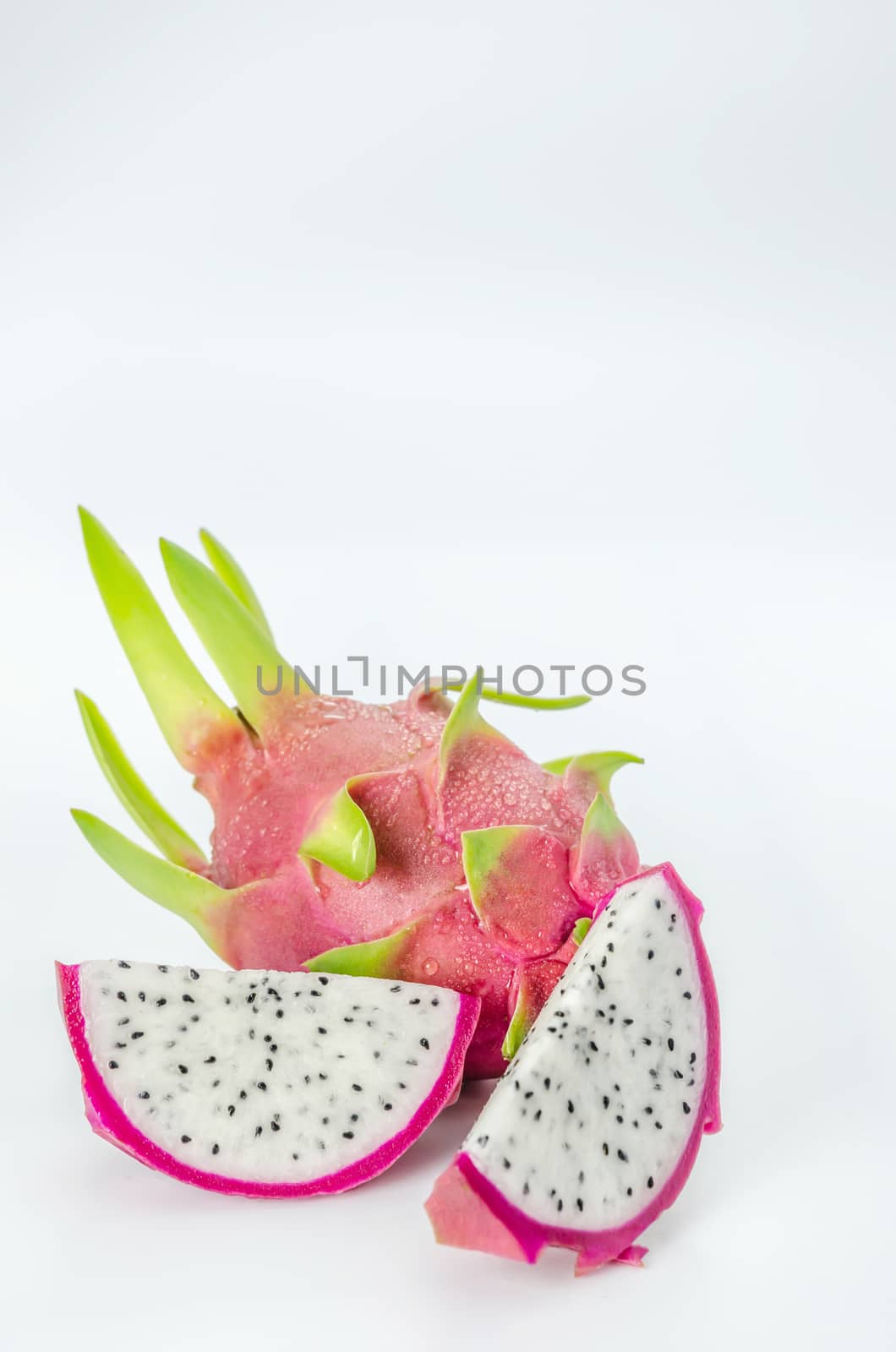 Ripe Dragon fruit or Pitaya with slice on white background
