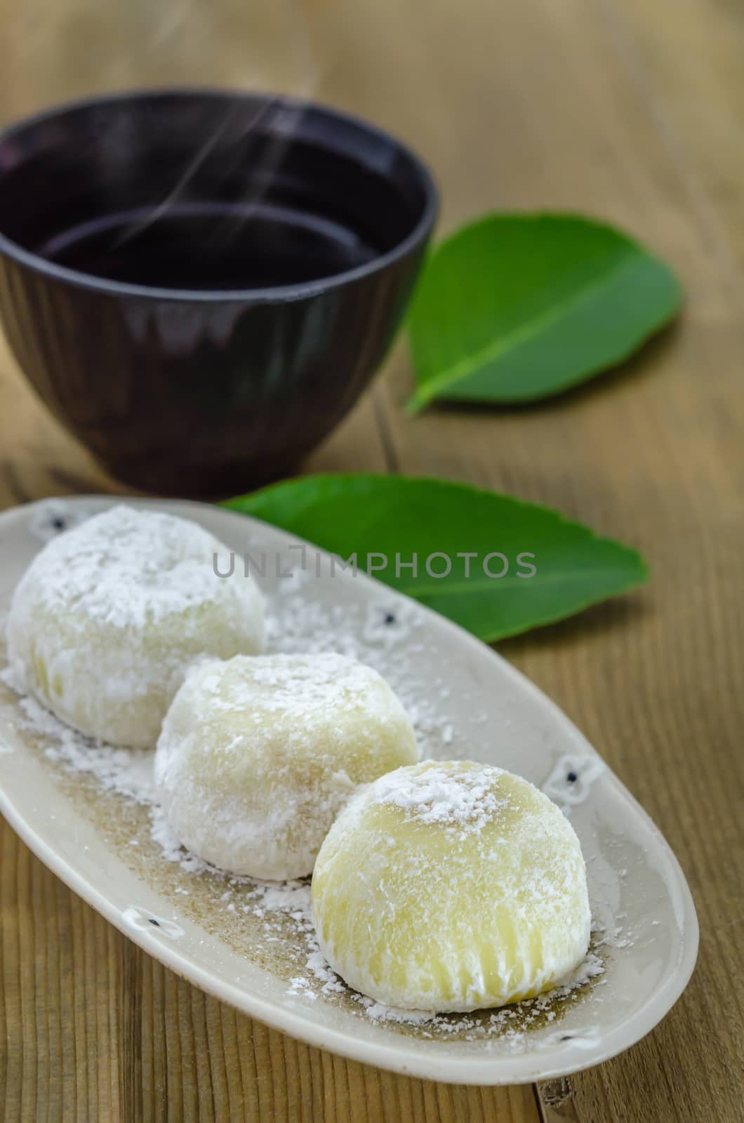 Daifuku Mochi Japanese dessert on dish with  hot tea , still life