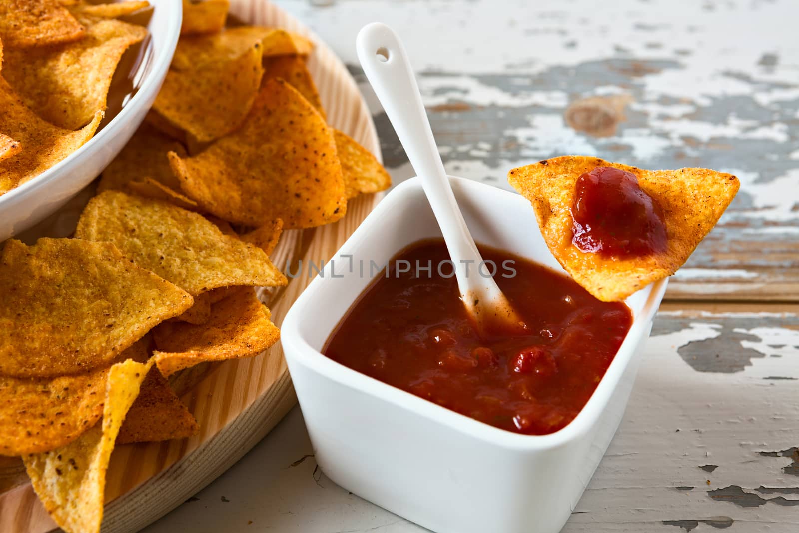 Close up of chili sauce and nachos chips