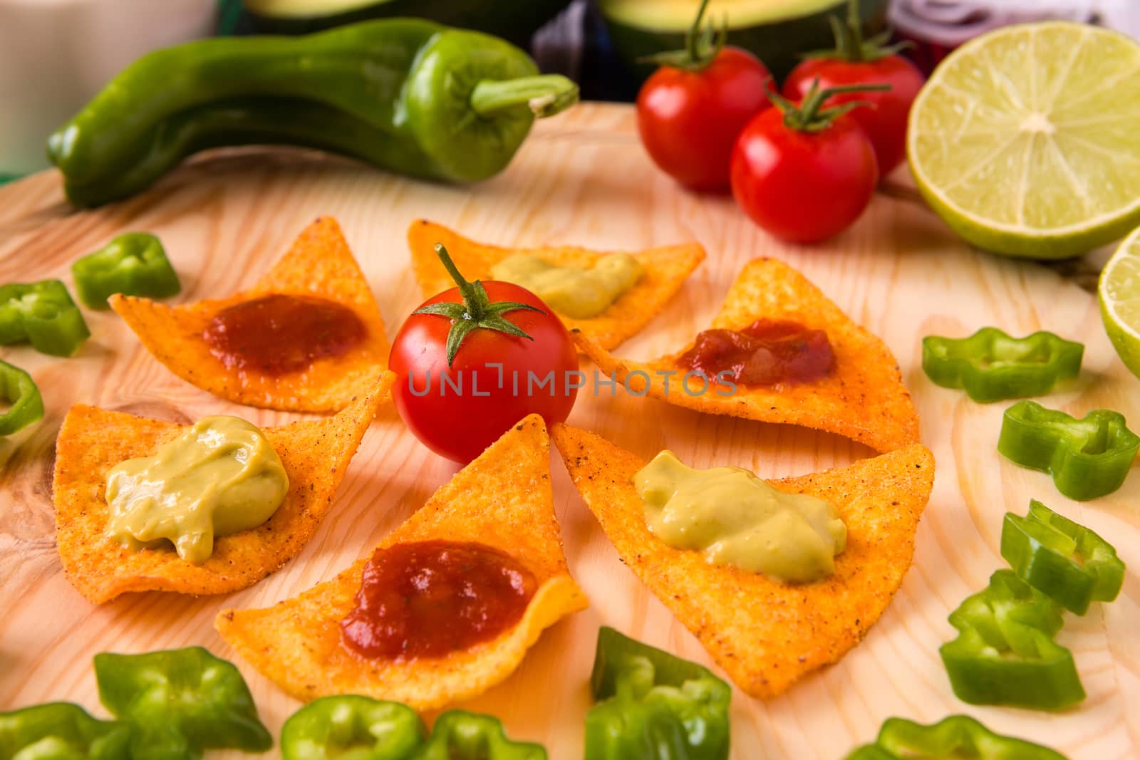 Close up of nachos chips and vegetables by LuigiMorbidelli