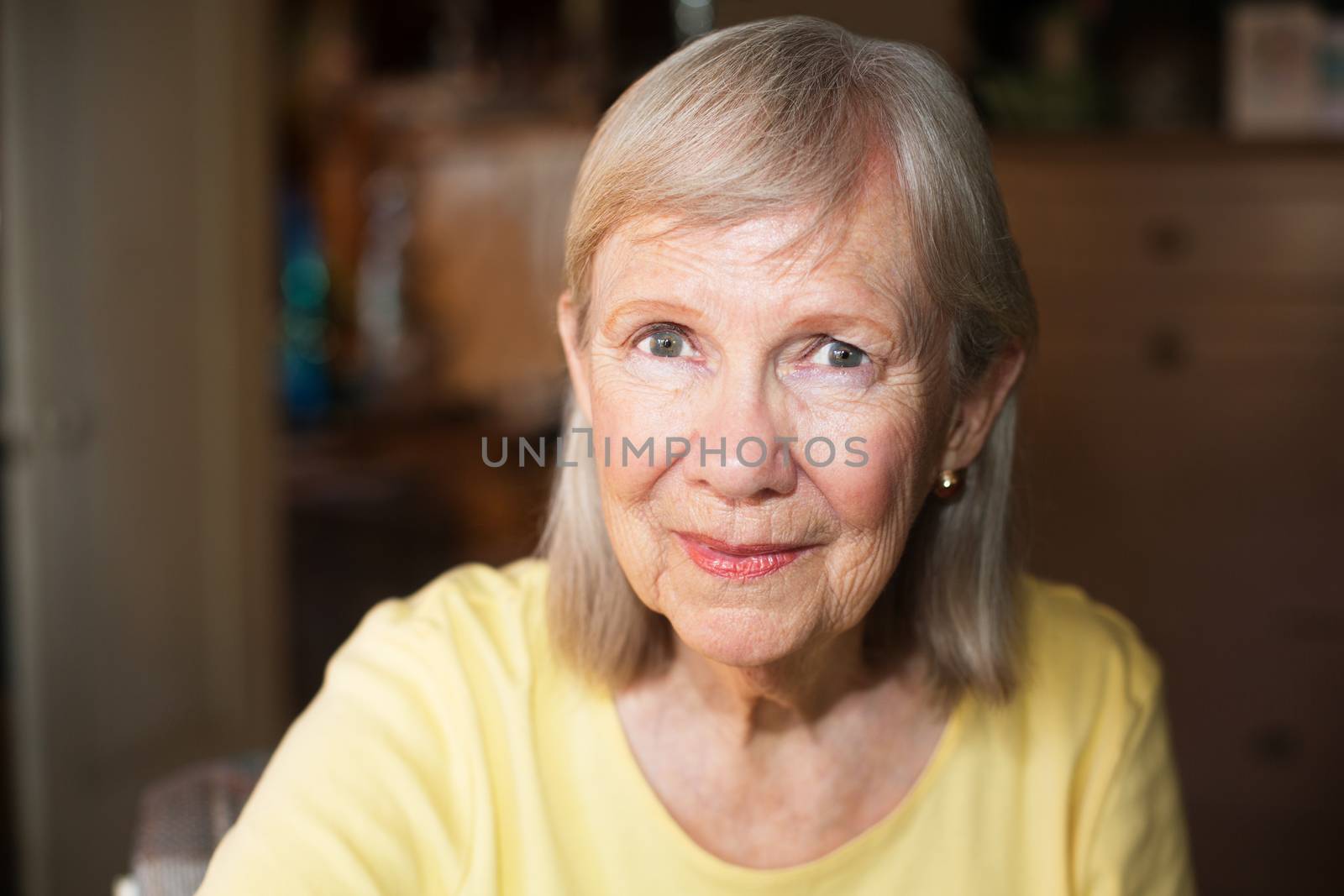 Close up on beautiful older woman with cheerful expression