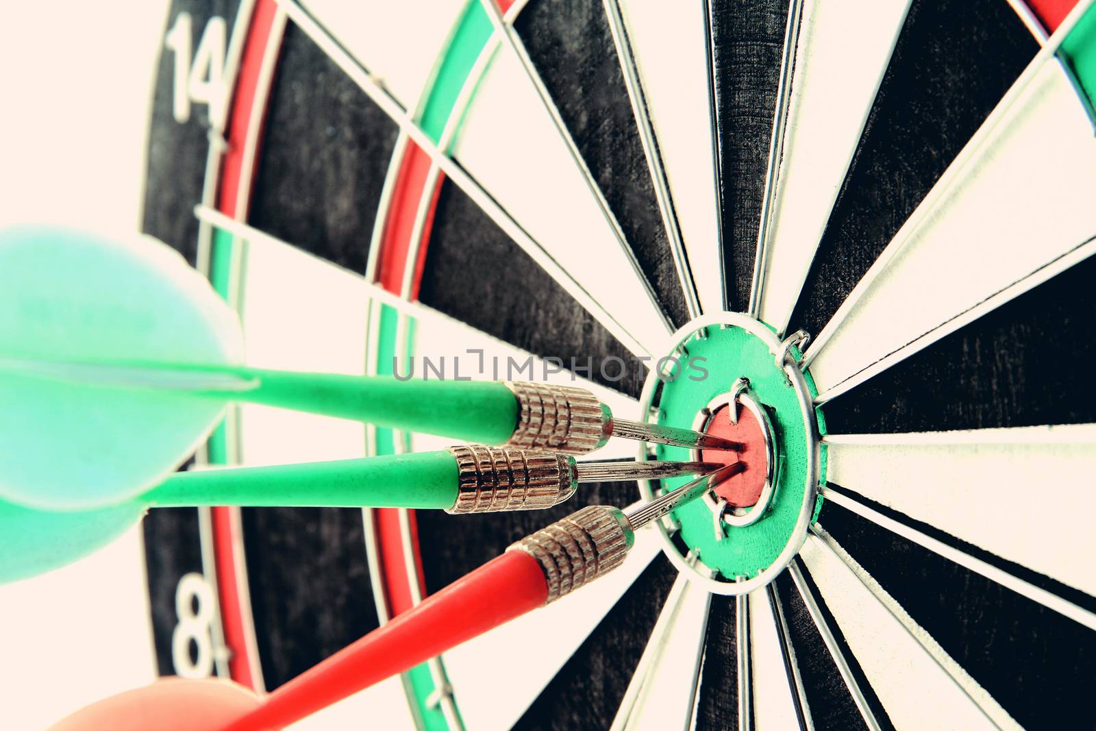 Darts board close up in vintage style. Concept of accuracy and success