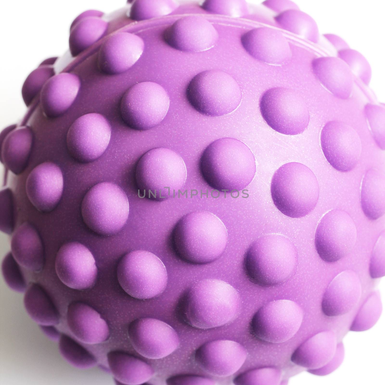 Rubber sensory ball of bright color isolated on white