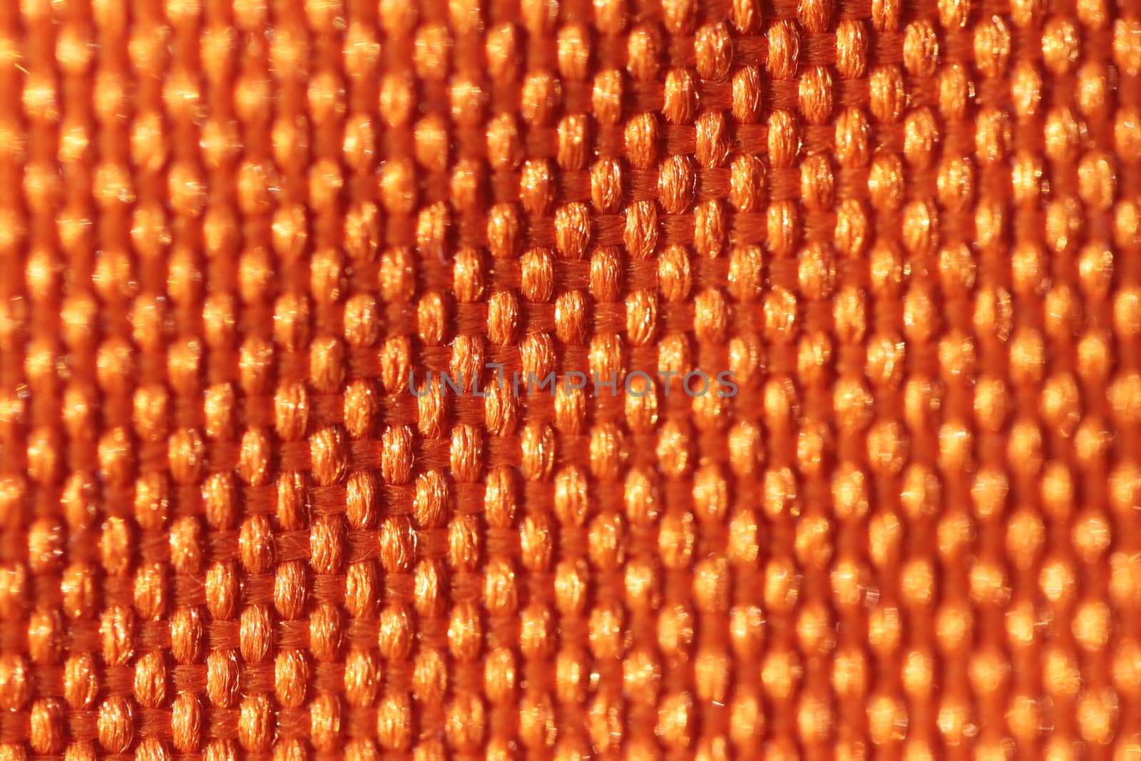 Abstract background of fabric material close up bright macro photo