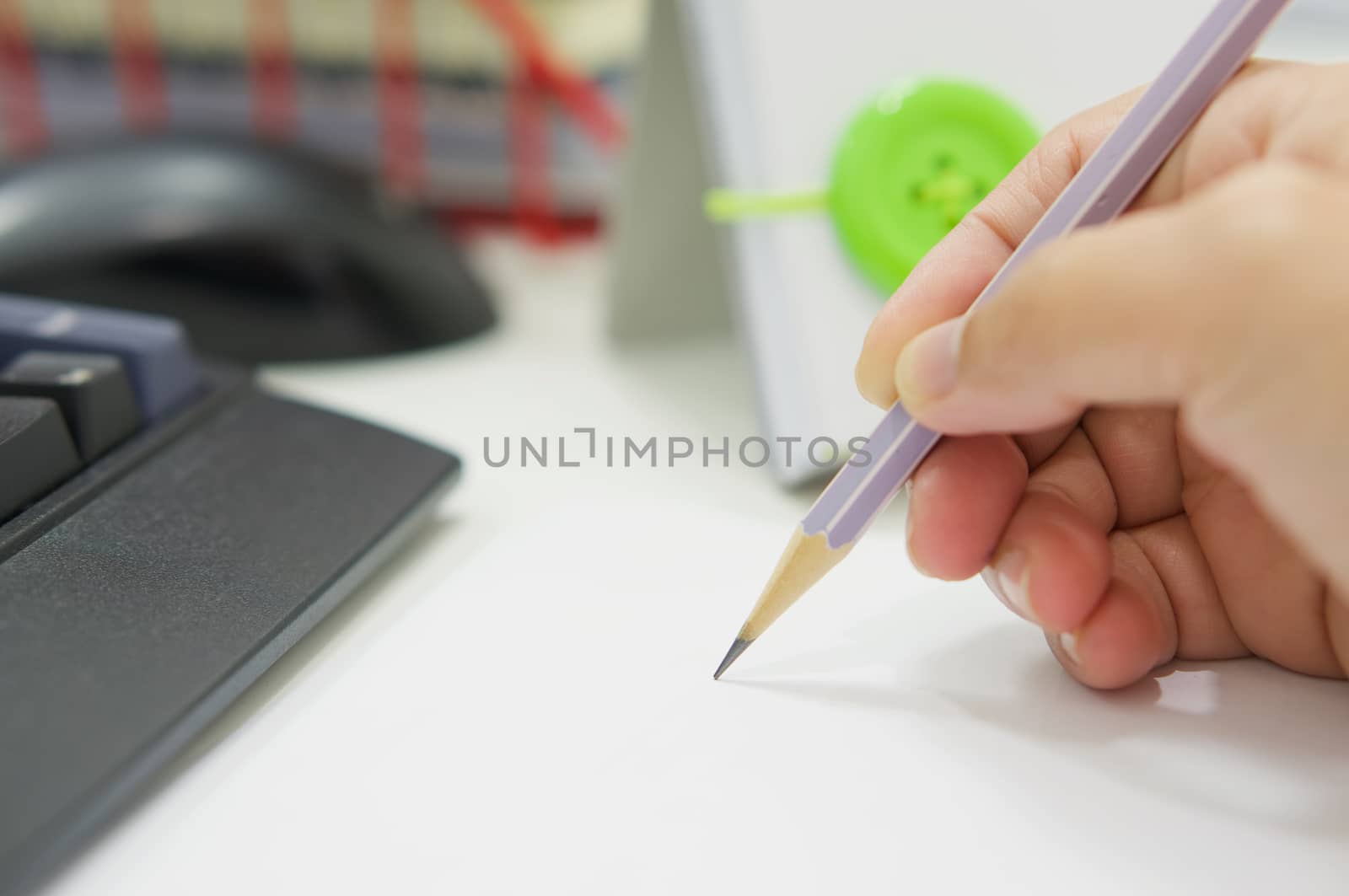 Hand with pencil on desk office by ninun