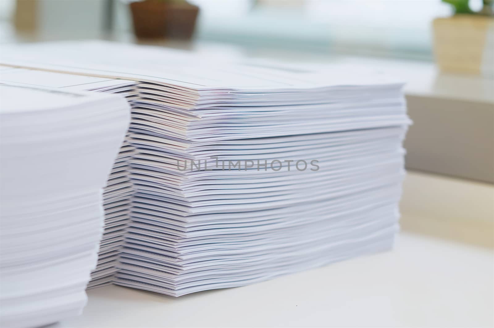 Stack of paper was put on table at office environment.                               
