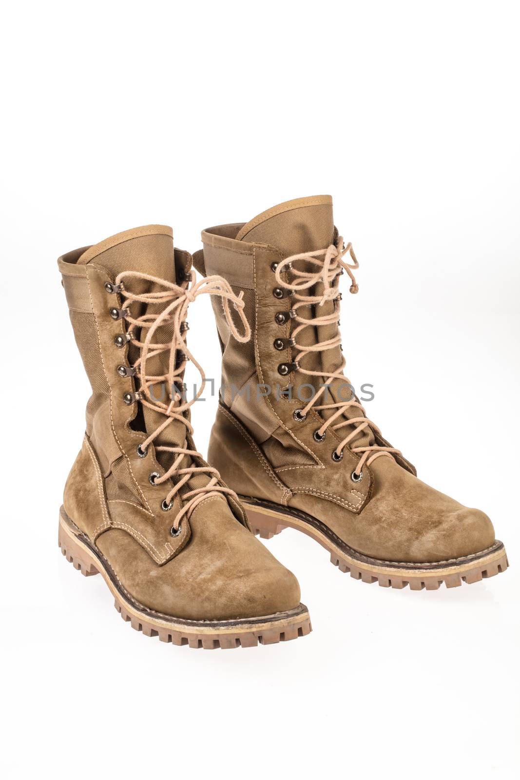 Pair of army boots on an isolated studio background
