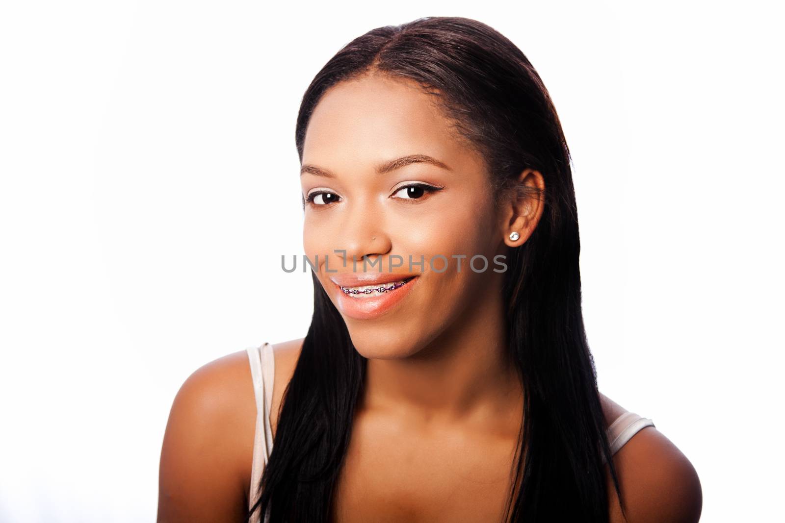 Beautiful happy smiling teenage girl with dental braces, on white.