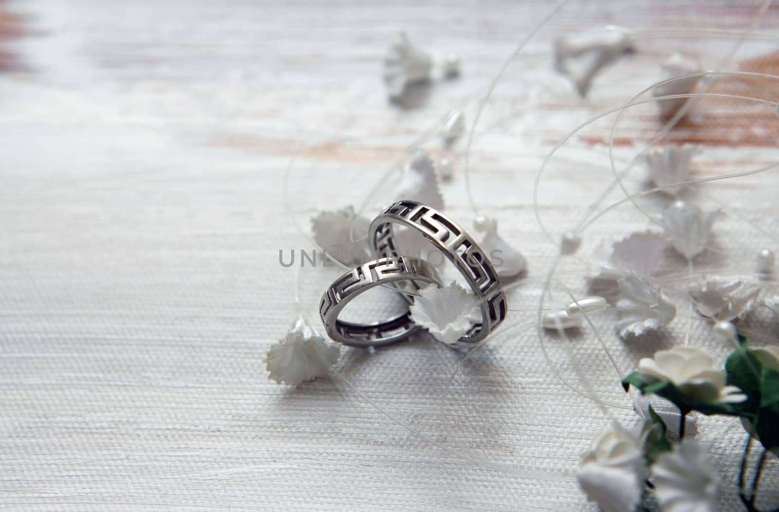 Wedding rings on a satiny fabric