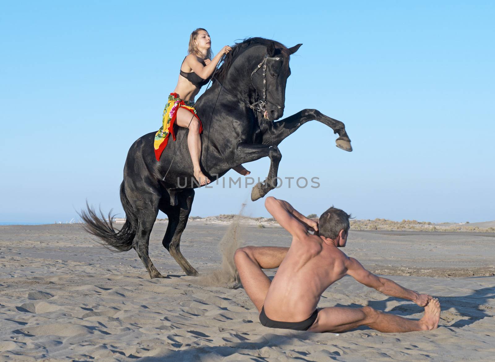 horsewoman and her horse  and yogi on the beach