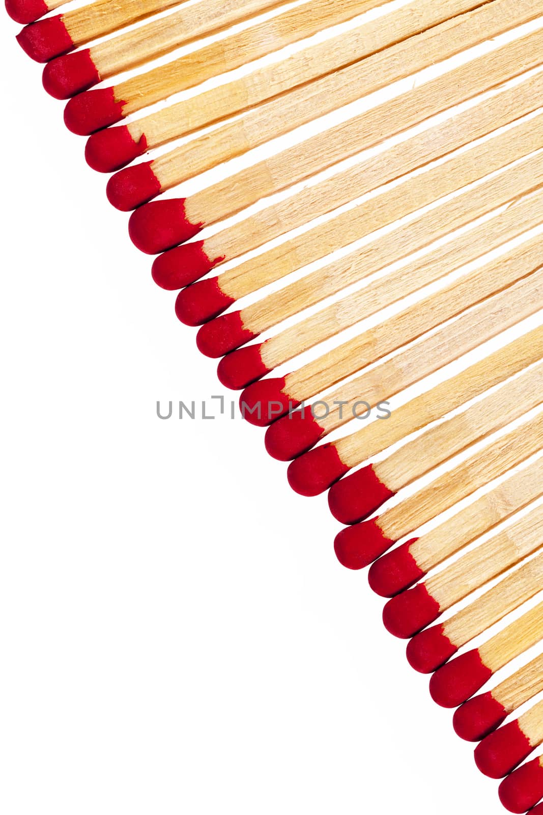 composition of matches with rad heads isolated on white background, close up