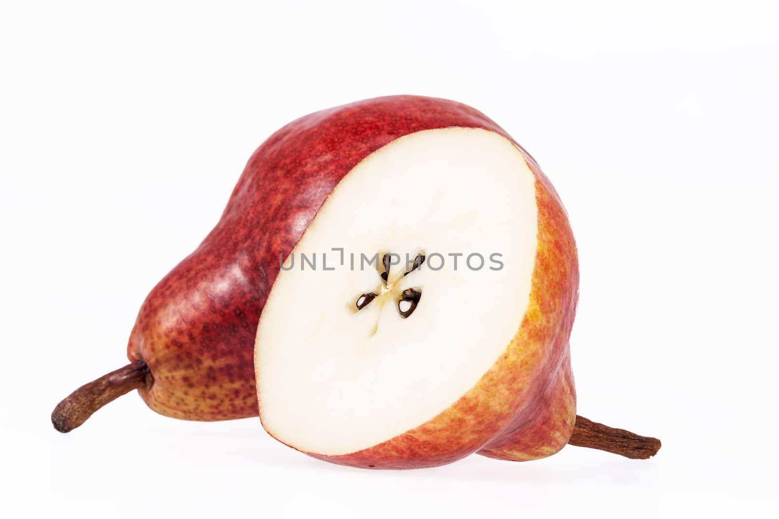 Two and half fruits of red pear isolated on white background.
