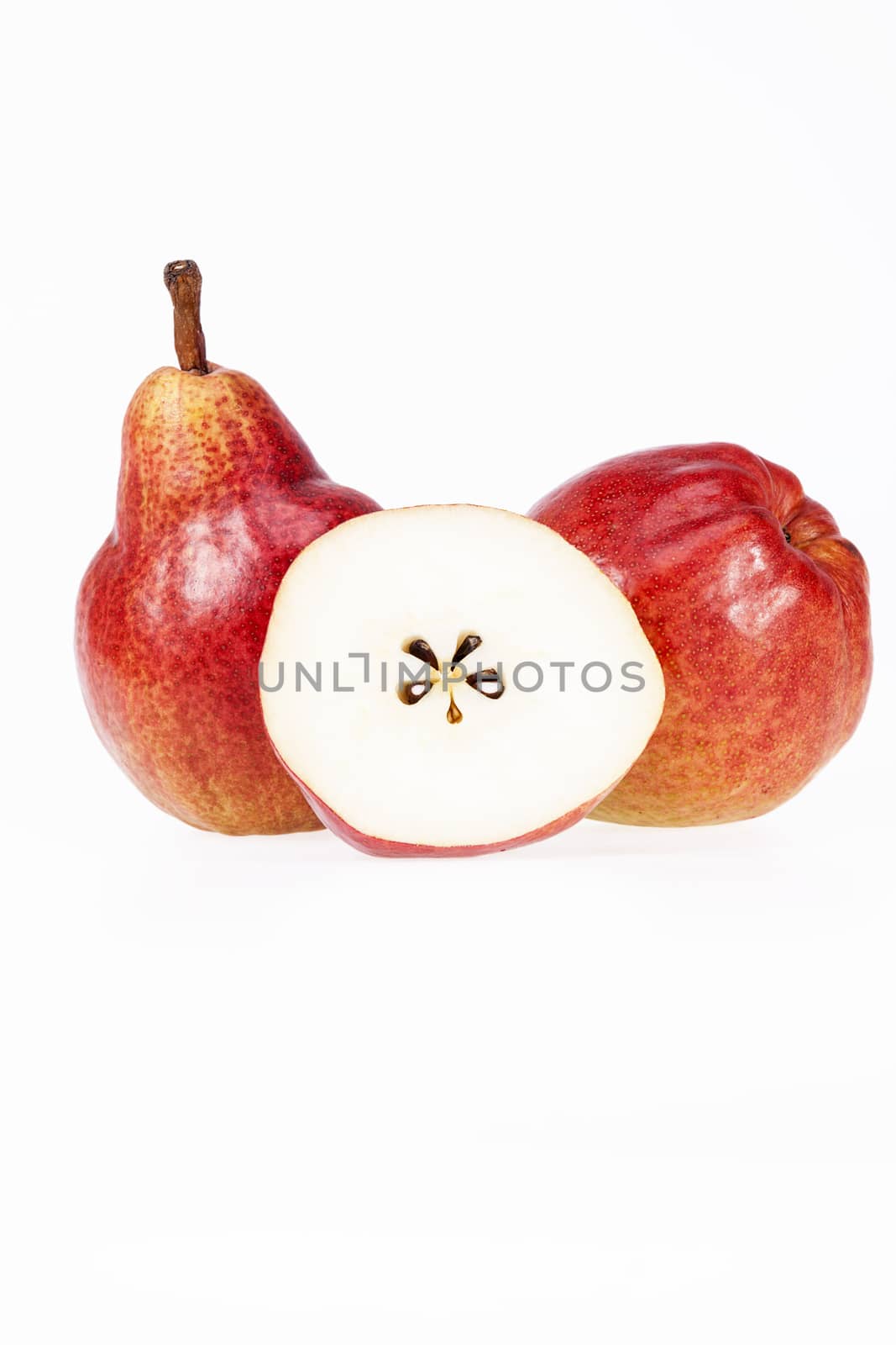 Two and half fruits of red pear isolated on white background by mychadre77