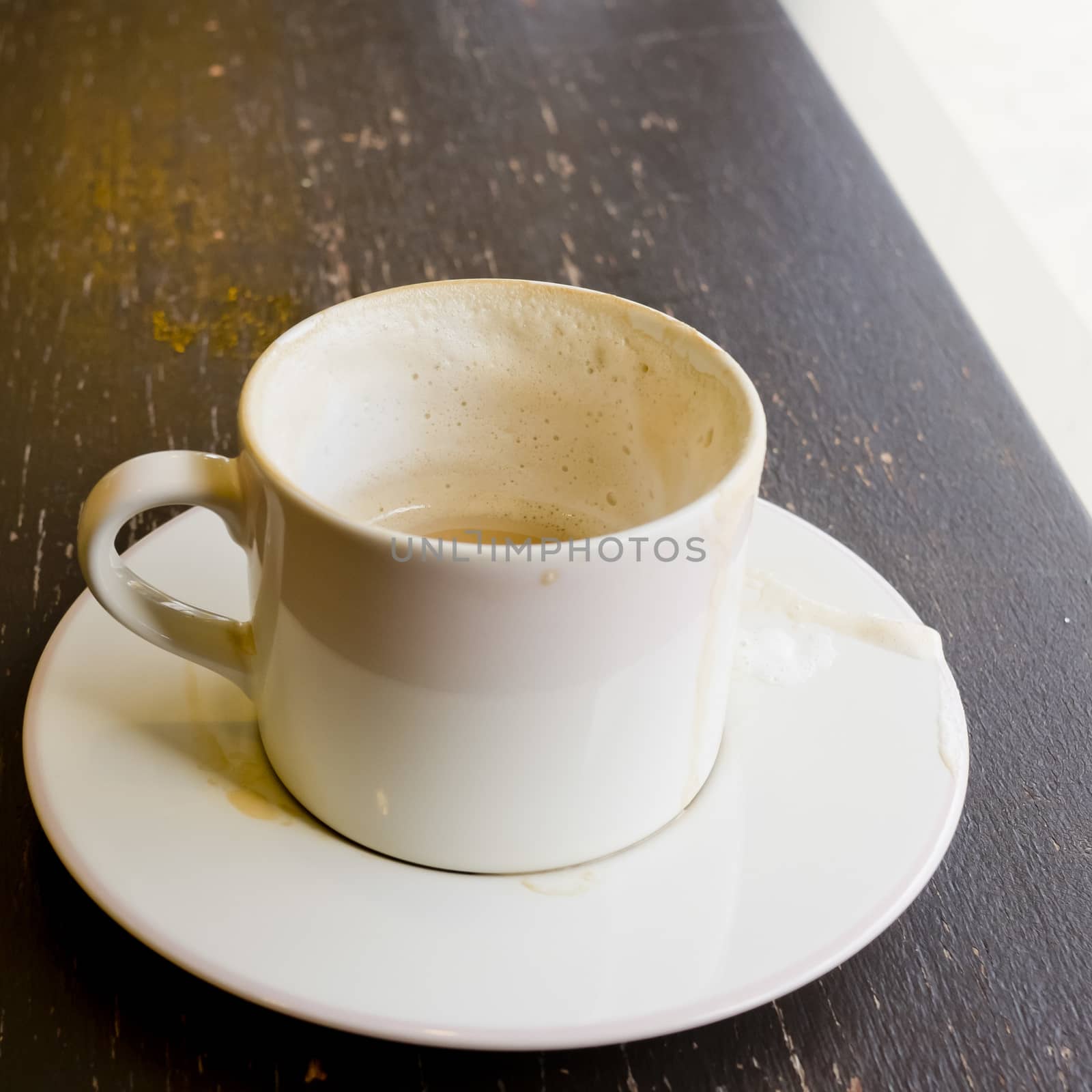 Empty coffee cup on wood table at coffee shop by art9858