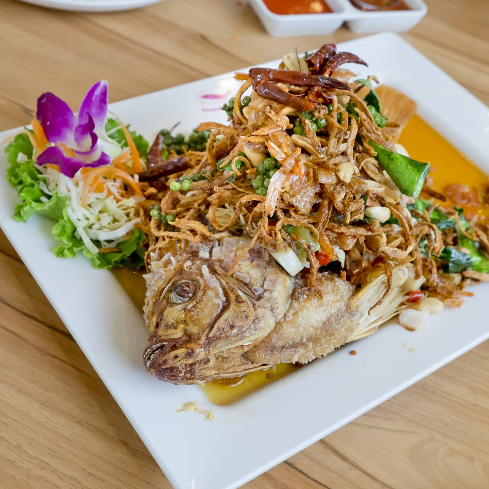 Deep fried fish with herb salad (Thai dish and healthy food) by art9858