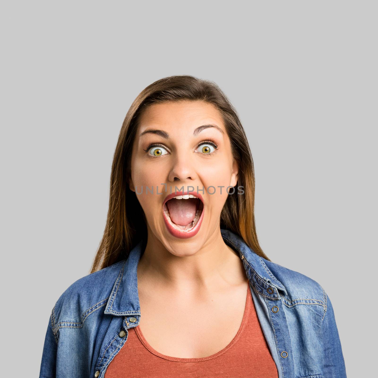 Portrait of a beautiful woman shouting very loud