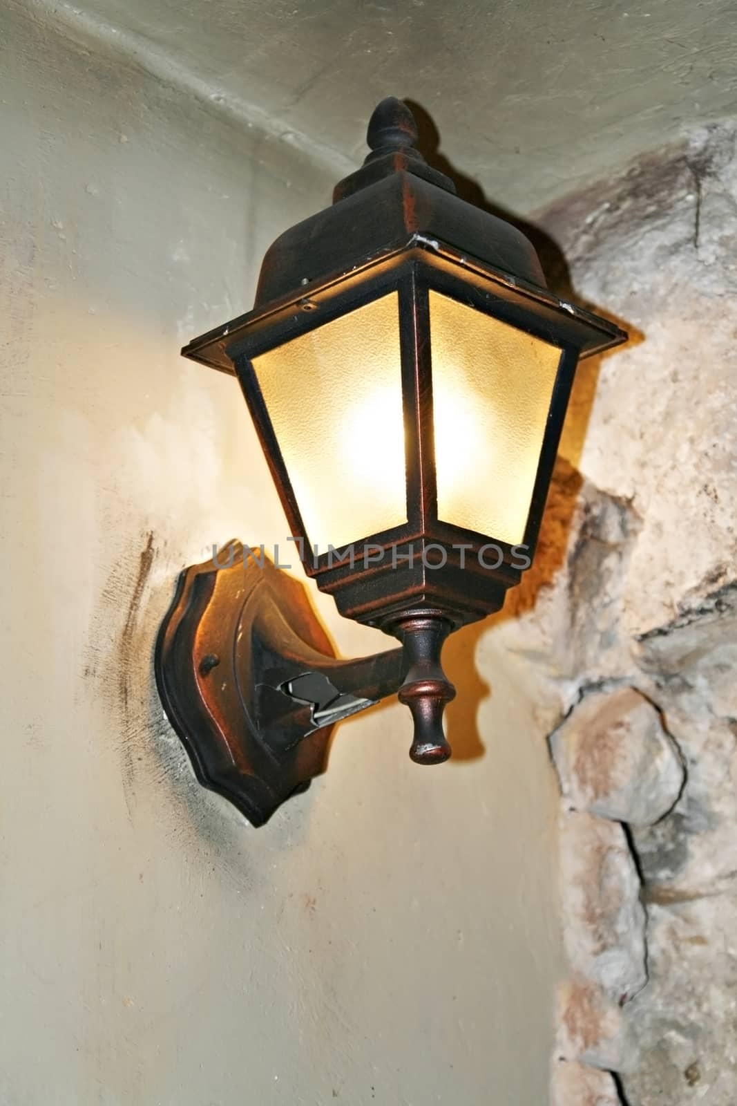 Old lantern on the wall close-up of the house by Tanacha