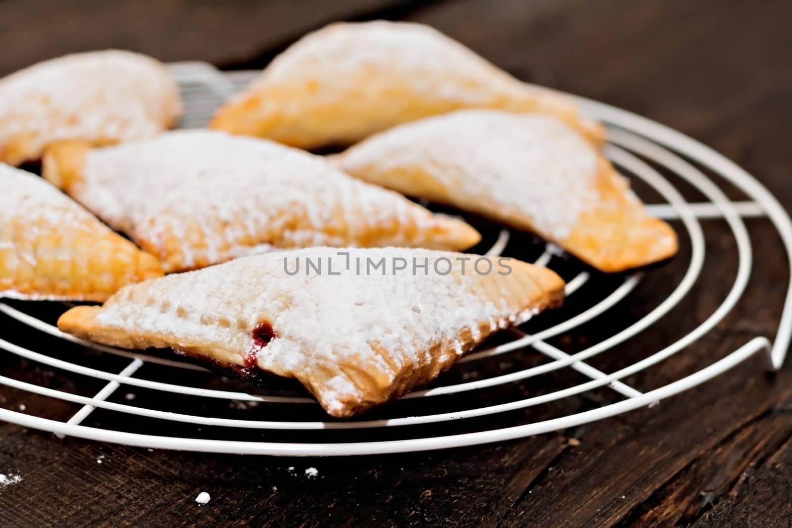 layered angles with cherry under powdered sugar.