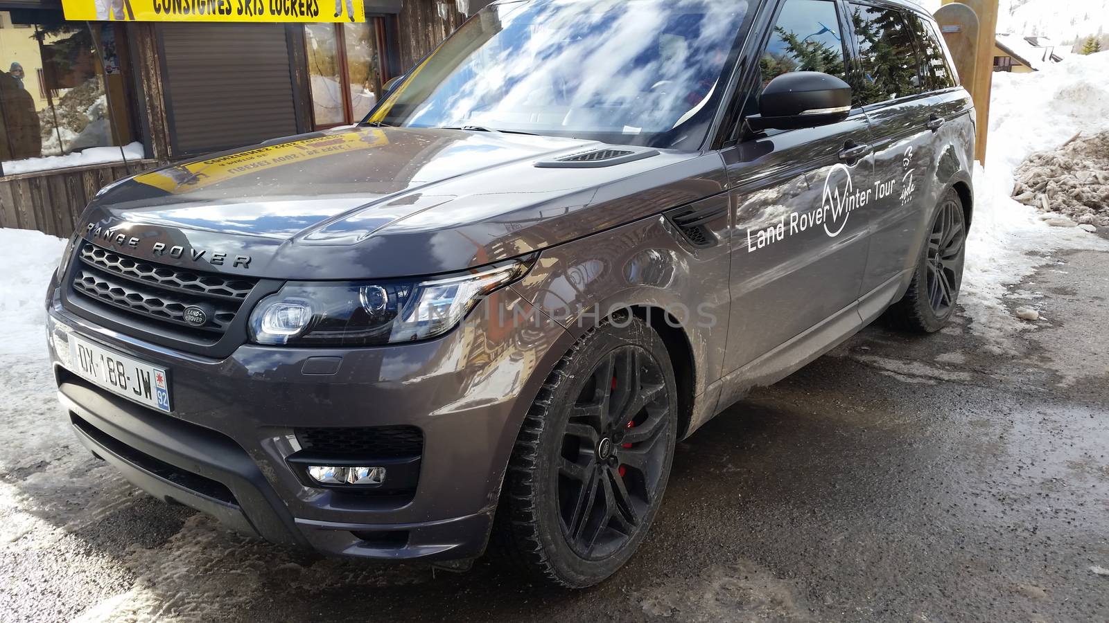 Isola 2000, France - February 19, 2016: Luxurious Land Rover Range Rover Sport SUV Parked on the Snow in a Ski Resort, Commune of Isola, Alpes-Maritimes