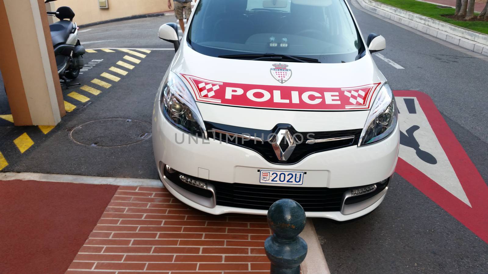 Fontvieille, Monaco - September 29, 2016: Renault Scenic III TCe Police Car (Front View), Car of Monaco Police Patrol on the City Street of Fontvieille In Monaco, French Riviera
