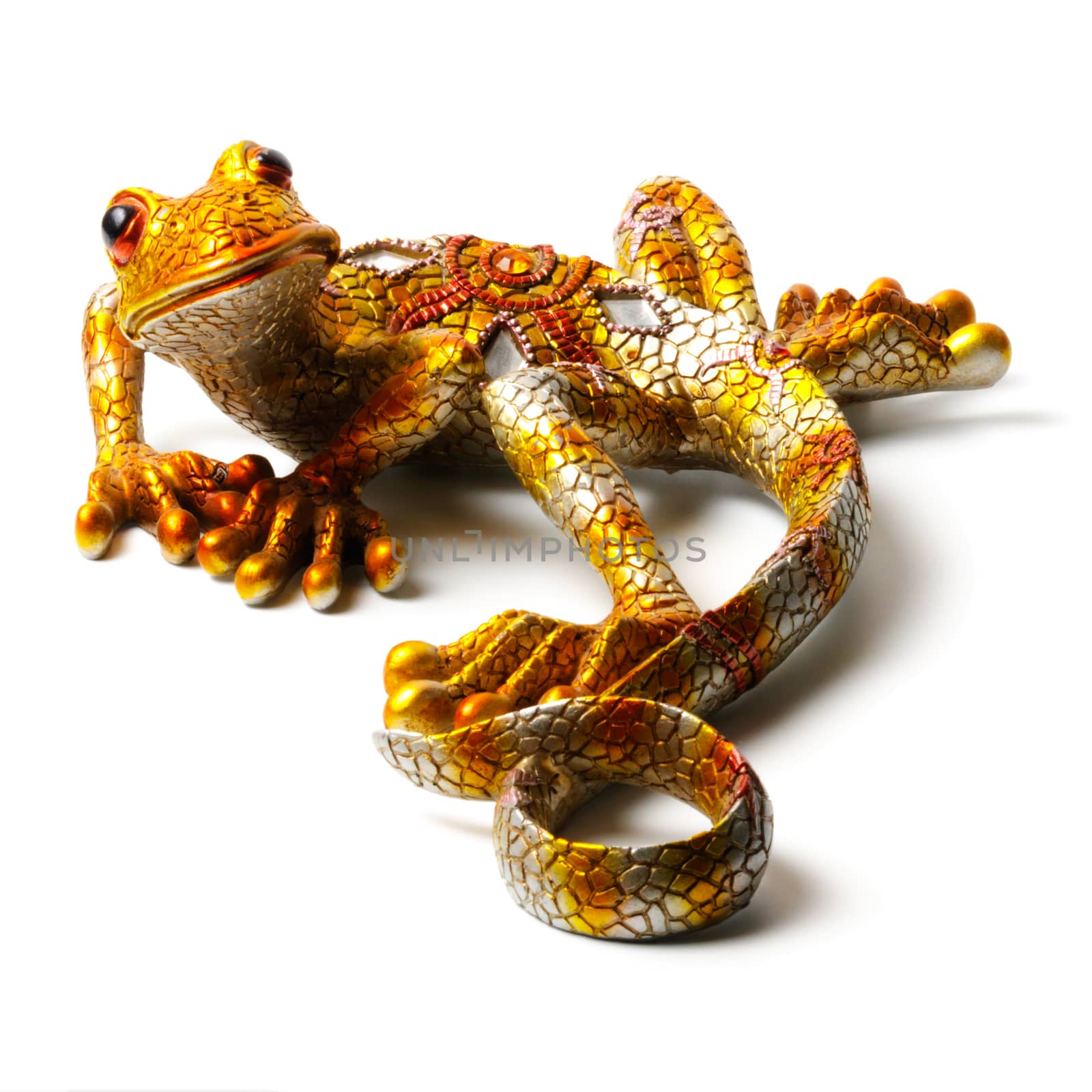 Bright statuette of the lizard isolated on white background