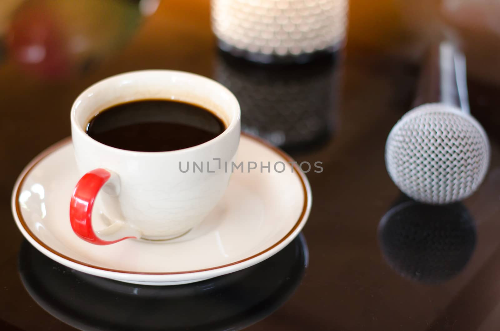 Cup of hot coffee in music  on black  background