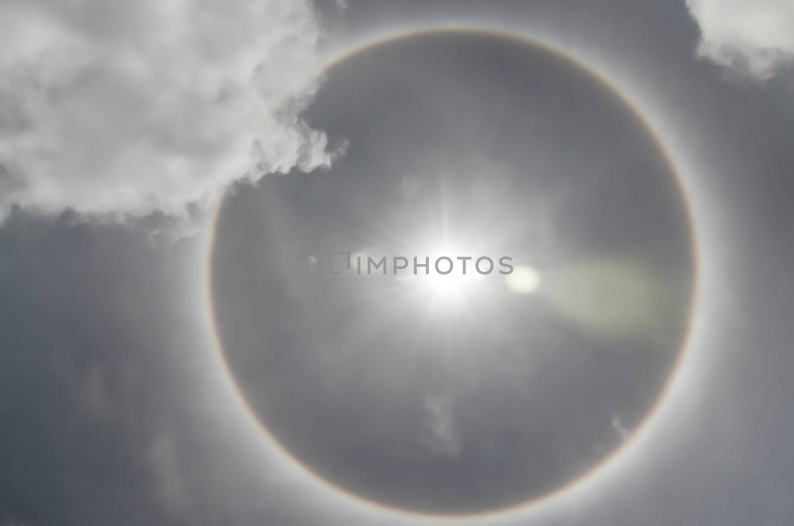 Sun with circular rainbow  sun halo occurring due to ice crystal by metal22