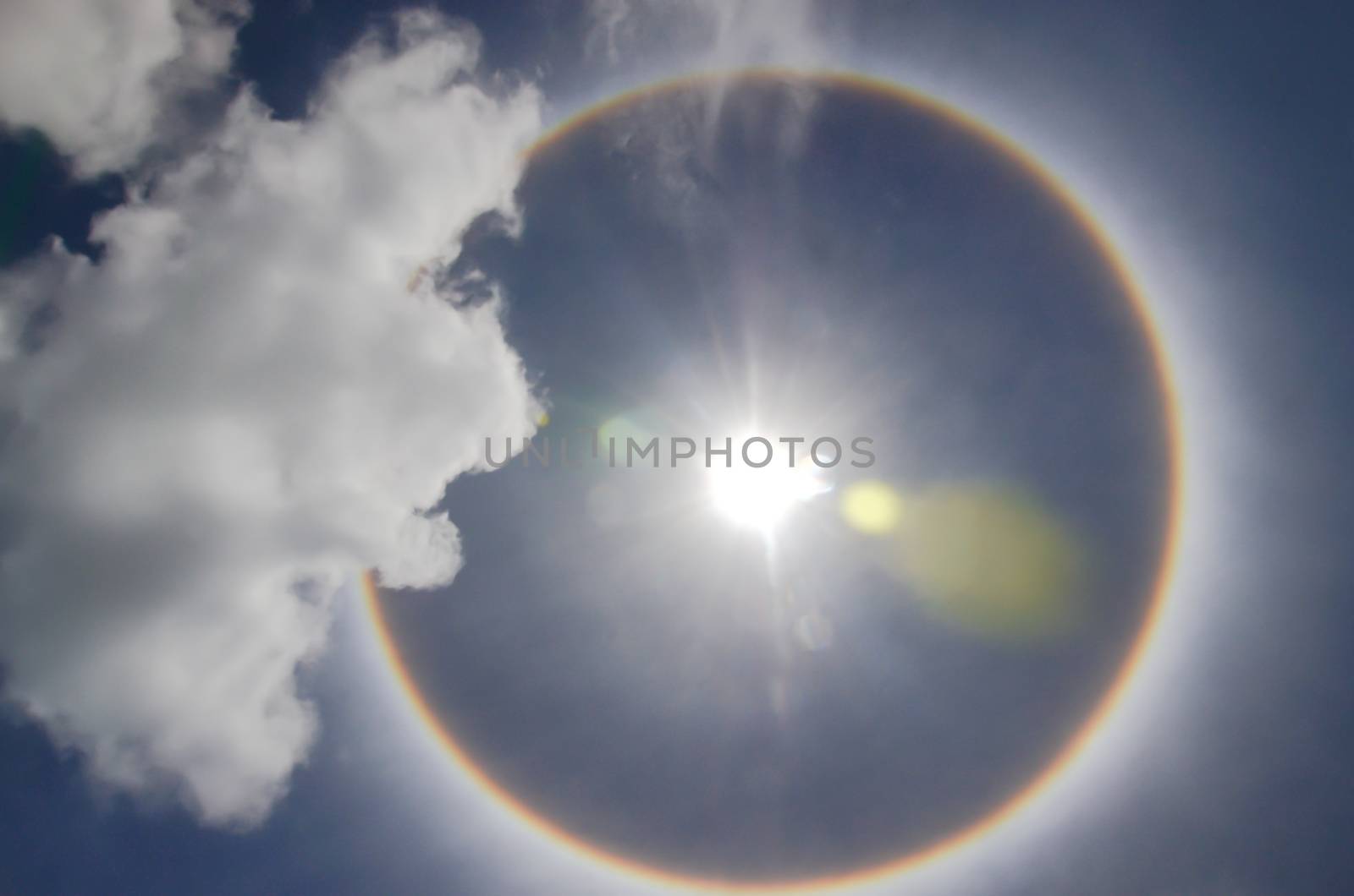 Sun with circular rainbow  sun halo occurring due to ice crystal by metal22