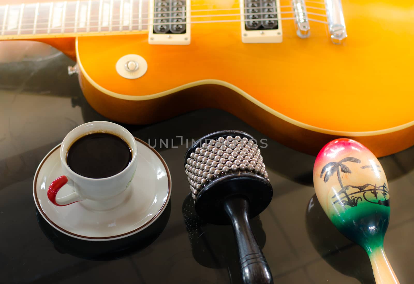 Cup of hot coffee in music  on black  background