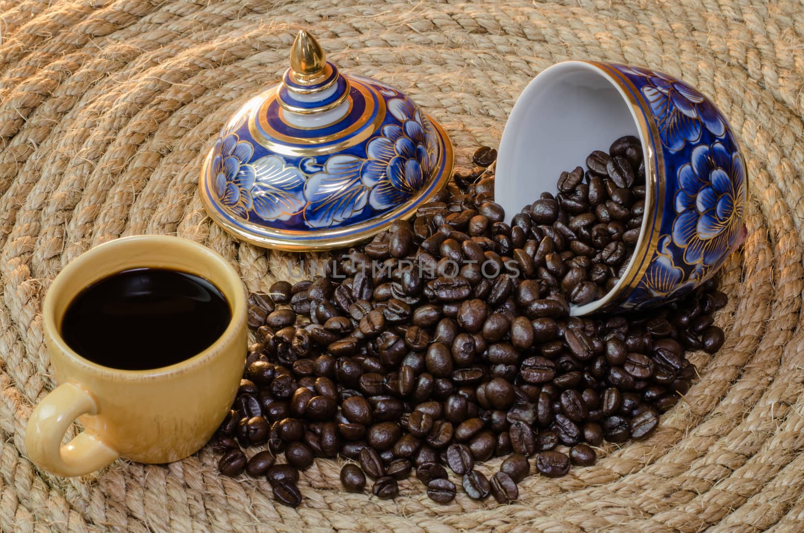 Cup of coffee with Benjarong on a jute rope.